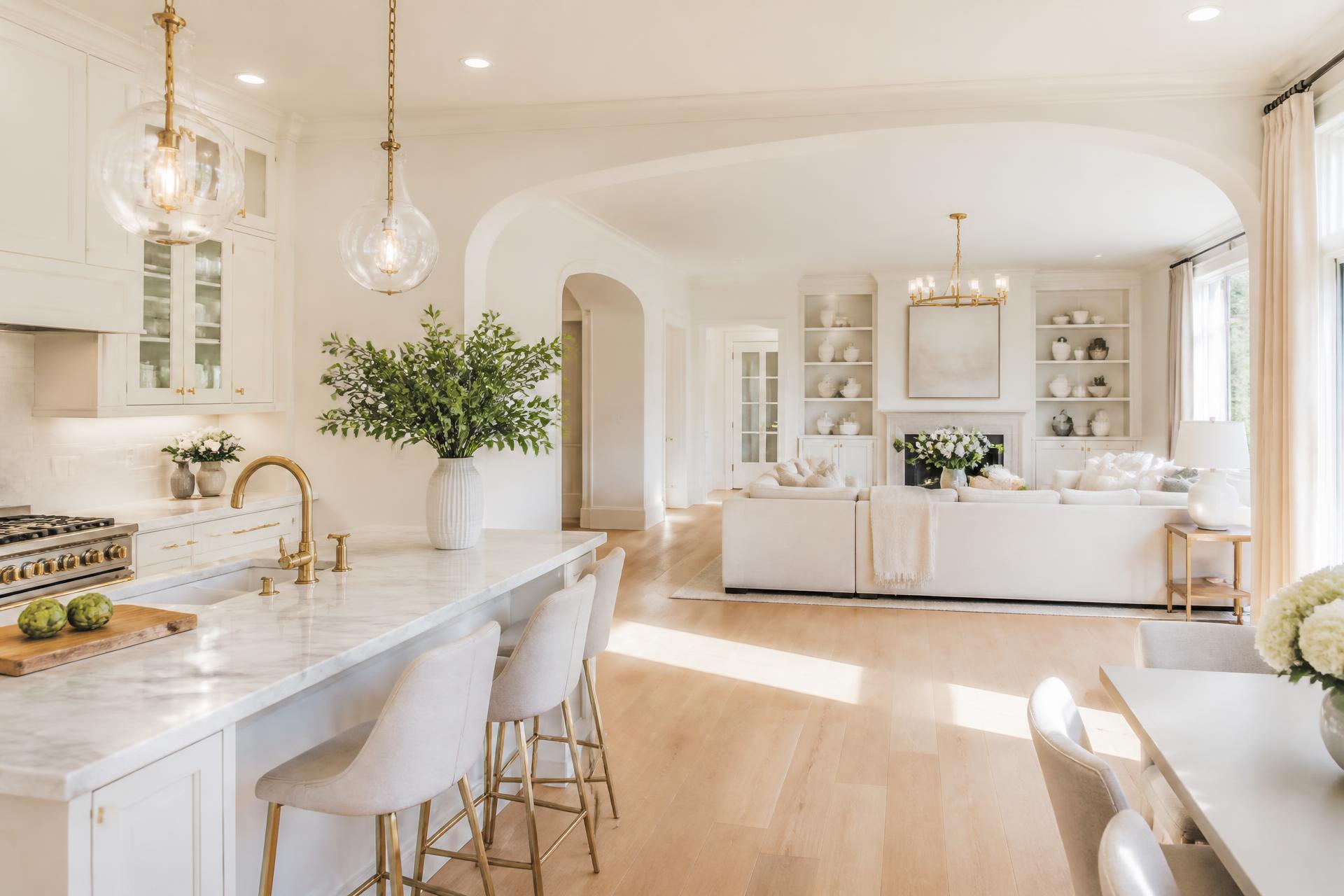 Bright, immaculately cleaned open-plan kitchen and living room in an upscale home